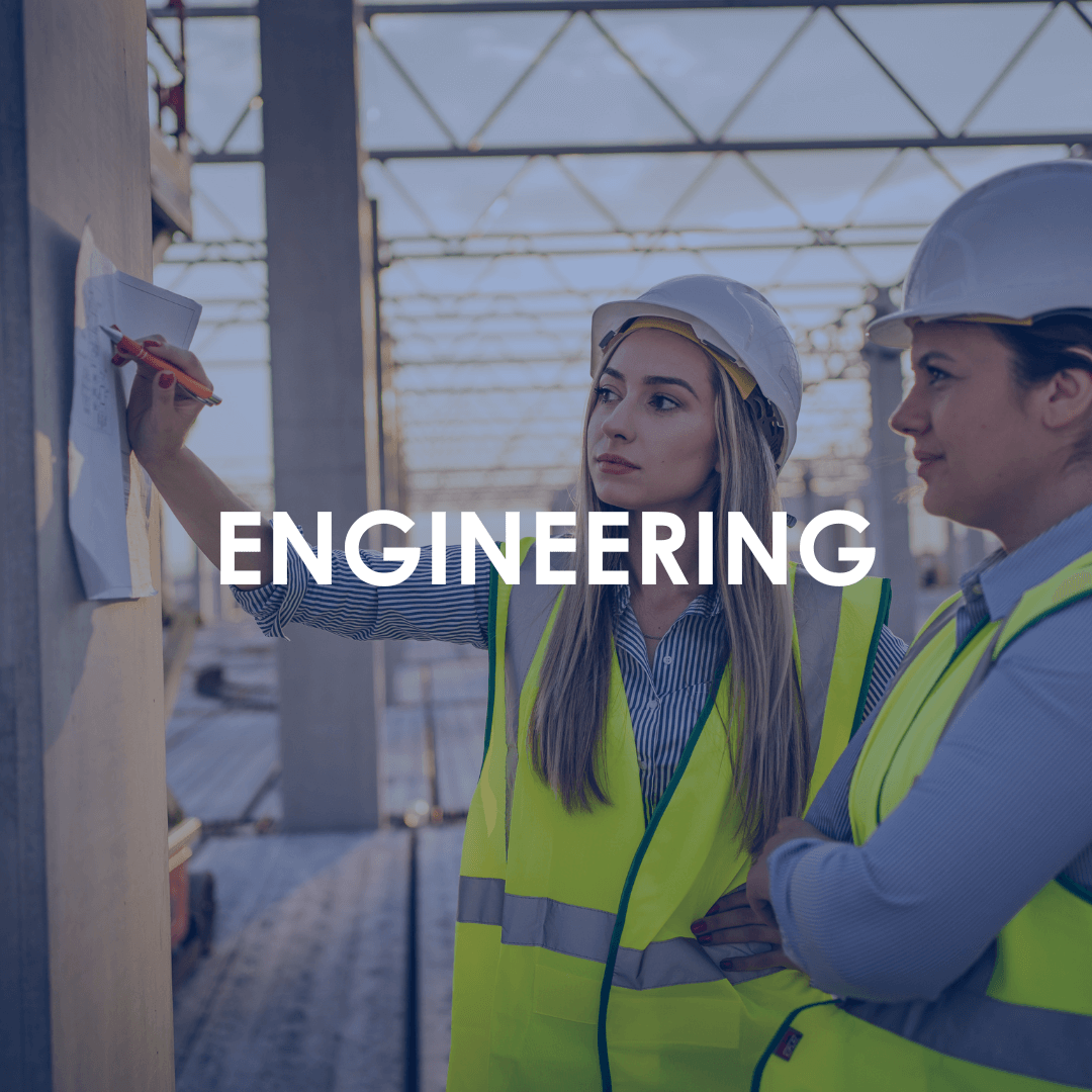industrial recruitment - engineering Industrial Recruitment - Two female engineers in hard hats looking at a plan