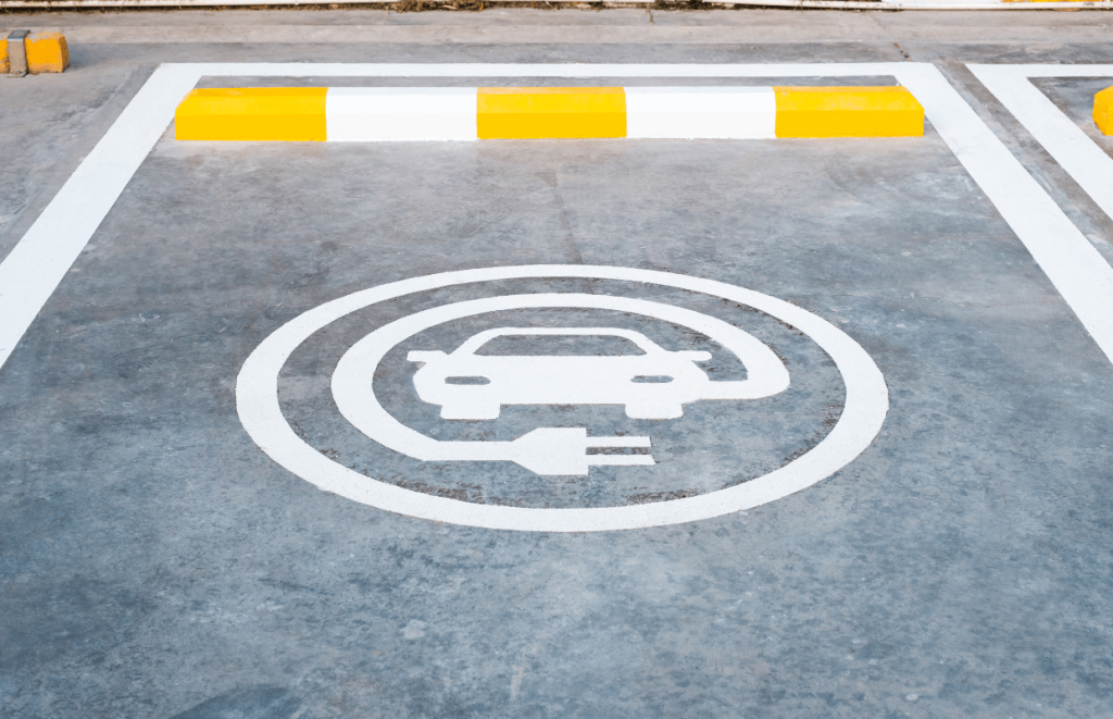 Car parking space with an EV charging sign on the floor