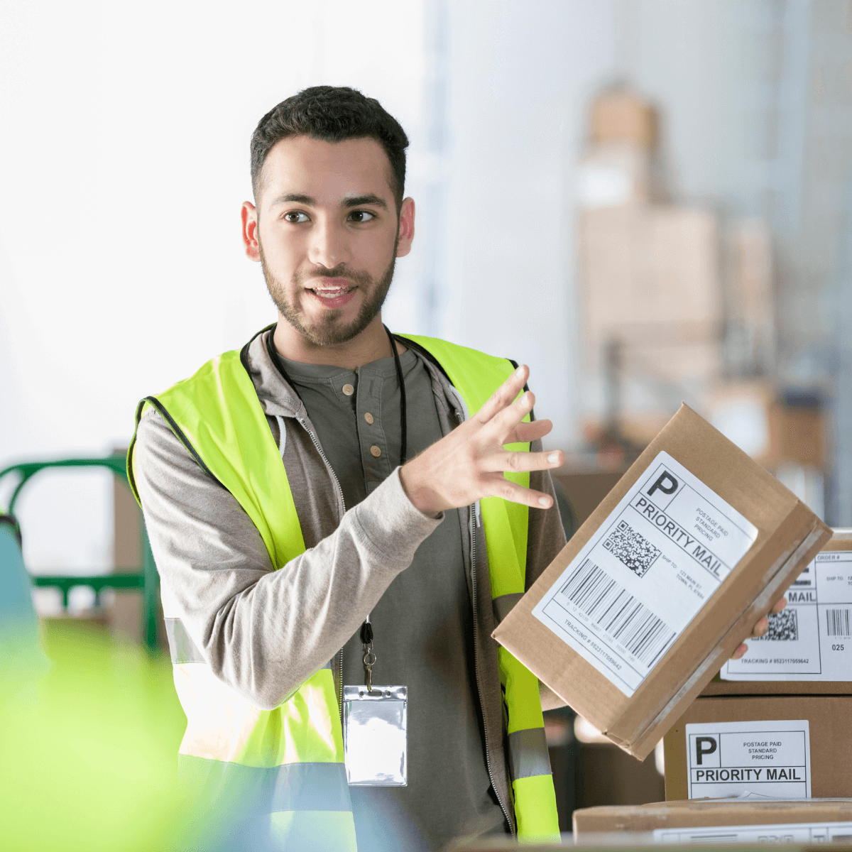 Manual Handling - Platinum Employment Factory worker holding a carboard box giving manual handling training